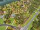 An aerial view of the property boundaries with a beautiful brick home and mature trees at 315 Monroe Dr, Mcdonough, GA 30252