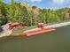 Scenic aerial view of the lake and shore featuring access ramps and small docks at 315 Monroe Dr, Mcdonough, GA 30252