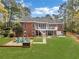 Backyard with a multi-tiered deck, cozy seating area, and a lush lawn at 315 Monroe Dr, Mcdonough, GA 30252