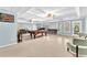 Spacious basement featuring a pool table, a sitting area, and a door leading to the exterior at 315 Monroe Dr, Mcdonough, GA 30252