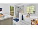 Bright bathroom featuring standalone tub, glass shower, and modern fixtures at 315 Monroe Dr, Mcdonough, GA 30252