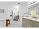 Bright bathroom featuring dual sinks, ample counter space, and tile floors at 315 Monroe Dr, Mcdonough, GA 30252