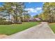 Beautiful brick home with an inviting entrance and a long drive leading to the residence at 315 Monroe Dr, Mcdonough, GA 30252