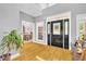 Inviting foyer with wood floors and view to the formal dining area at 315 Monroe Dr, Mcdonough, GA 30252