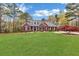 Beautiful brick home with black shutters and landscaped lawn, creating a welcoming curb appeal at 315 Monroe Dr, Mcdonough, GA 30252