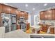 Well-equipped kitchen boasting stainless steel appliances, wood cabinets, and durable granite countertops at 315 Monroe Dr, Mcdonough, GA 30252