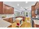 Functional kitchen featuring granite countertops, wood cabinets, stainless steel appliances, and a central island at 315 Monroe Dr, Mcdonough, GA 30252