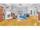 Spacious living room with fireplace, hardwood floors, large windows, and neutral wall paint at 315 Monroe Dr, Mcdonough, GA 30252