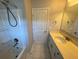 Bright bathroom featuring double sink vanity and shower-tub combo at 5530 Lacebark Pine Ct, Cumming, GA 30040