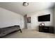 Neutral bedroom with a twin bed, TV, and gray carpet at 5530 Lacebark Pine Ct, Cumming, GA 30040