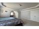 This bedroom has gray walls, carpeted floors, a double door closet and a window for natural light at 5530 Lacebark Pine Ct, Cumming, GA 30040