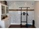 Exercise room featuring a pull-up bar and a white accent wall at 5530 Lacebark Pine Ct, Cumming, GA 30040