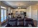 View of the kitchen, featuring white cabinets, an island with seating, and stainless steel appliances at 5530 Lacebark Pine Ct, Cumming, GA 30040