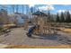 Community playground with slide and climbing structure, great for Gathering fun and outdoor activities at 5530 Lacebark Pine Ct, Cumming, GA 30040