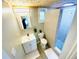 Bright bathroom featuring a tiled shower, modern vanity, and contemporary fixtures at 8562 Lake Dr, Snellville, GA 30039