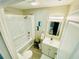 Well-lit bathroom featuring a sleek vanity, bathtub-shower combo, and modern fixtures for added convenience at 8562 Lake Dr, Snellville, GA 30039