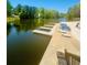 Lakefront area with docks, and seating for relaxing by the water at 8562 Lake Dr, Snellville, GA 30039