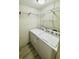 Functional laundry room with a washer and dryer setup, and shelving for organization at 8562 Lake Dr, Snellville, GA 30039
