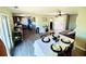 Open-concept living space features a dining area, hardwood floors, and seamless flow into the kitchen at 8562 Lake Dr, Snellville, GA 30039