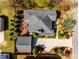 Aerial perspective of the property showcasing the house, garage, driveway, and surrounding landscape at 1324 Cambridge Ave. Sw, Atlanta, GA 30344