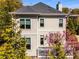 Rear of the residence with porch, showcasing a well-maintained yard and blossoming trees at 1324 Cambridge Ave. Sw, Atlanta, GA 30344