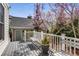 Spacious back porch with grey deck overlooking a fenced-in backyard at 1324 Cambridge Ave. Sw, Atlanta, GA 30344