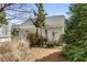 Backyard with a detached garage, landscaping, and flowering trees at 1324 Cambridge Ave. Sw, Atlanta, GA 30344