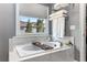 Relaxing bathroom features a large soaking tub with jets, a window for natural light, and elegant marble finishes at 1324 Cambridge Ave. Sw, Atlanta, GA 30344