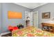 Bedroom featuring a floral-patterned bedspread and a view of the living room at 1324 Cambridge Ave. Sw, Atlanta, GA 30344