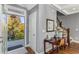 Inviting entryway with natural light, hardwood floors, and elegant decor provides a warm welcome at 1324 Cambridge Ave. Sw, Atlanta, GA 30344