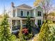 Charming two-story home featuring a welcoming front porch and beautifully landscaped front yard at 1324 Cambridge Ave. Sw, Atlanta, GA 30344