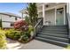 Inviting front entrance featuring landscaped gardens and a welcoming staircase leading to the front door at 1324 Cambridge Ave. Sw, Atlanta, GA 30344