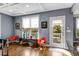 Cozy living room with a view to the outdoor balcony, hardwood floors and coffered ceilings at 1324 Cambridge Ave. Sw, Atlanta, GA 30344
