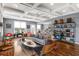 Spacious living room with coffered ceilings, hardwood floors, and a comfortable seating area at 1324 Cambridge Ave. Sw, Atlanta, GA 30344