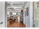 Open-concept living room featuring hardwood floors, coffered ceilings, and abundant natural light at 1324 Cambridge Ave. Sw, Atlanta, GA 30344