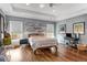 Large main bedroom boasts tray ceilings, hardwood floors, and large windows with natural light at 1324 Cambridge Ave. Sw, Atlanta, GA 30344
