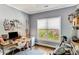 Home office with desk, computer, exercise bike and a window overlooking the backyard at 1324 Cambridge Ave. Sw, Atlanta, GA 30344
