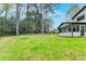 Expansive backyard and screened porch provide ample outdoor living and entertainment space at 1450 Cedarhurst Dr, Dunwoody, GA 30338