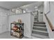 Basement area featuring stairs to the main level and a decorative shelving unit at 1450 Cedarhurst Dr, Dunwoody, GA 30338