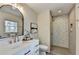 Modern bathroom with a stand-up shower, stylish fixtures, and neutral color scheme at 1450 Cedarhurst Dr, Dunwoody, GA 30338
