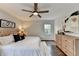 Comfortable bedroom with a ceiling fan, wood floors, and a neutral color scheme at 1450 Cedarhurst Dr, Dunwoody, GA 30338