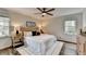 Well-lit bedroom with neutral colors, hardwood floors, and a comfortable layout at 1450 Cedarhurst Dr, Dunwoody, GA 30338