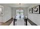 Traditional dining room with hardwood floors, stylish chandelier, and elegant table setting at 1450 Cedarhurst Dr, Dunwoody, GA 30338