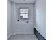 Functional laundry room featuring a window and tile accents at 1450 Cedarhurst Dr, Dunwoody, GA 30338
