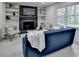 Cozy living room features a fireplace, built-in shelving, and a comfortable blue sofa at 1450 Cedarhurst Dr, Dunwoody, GA 30338