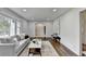 The living room features a large window, hardwood floors, and a comfortable seating area with a white rug at 1450 Cedarhurst Dr, Dunwoody, GA 30338
