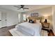 Bright main bedroom features a ceiling fan, ensuite access, and hardwood flooring at 1450 Cedarhurst Dr, Dunwoody, GA 30338