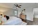 Cozy main bedroom offers hardwood flooring, a ceiling fan, and ample closet space at 1450 Cedarhurst Dr, Dunwoody, GA 30338