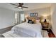 Bright main bedroom features a ceiling fan, ensuite access, and hardwood flooring at 1450 Cedarhurst Dr, Dunwoody, GA 30338