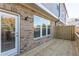 Inviting wooden deck with brick accent wall, exterior door, and views of backyard at 4589 Hawthorn Rose Ln, Buford, GA 30518